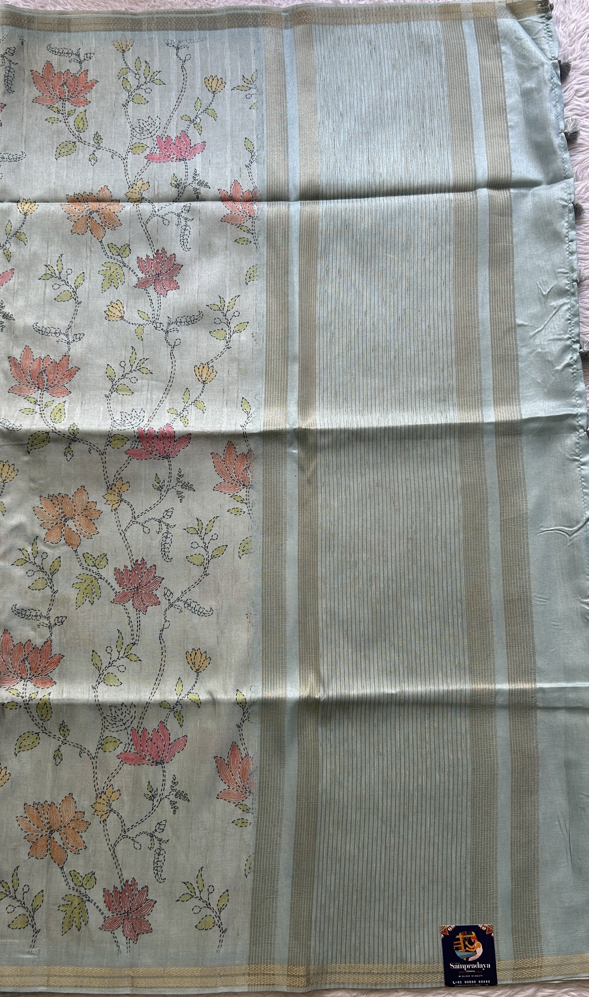 Semi Tussar Saree Colored Grayish Blue Complemented with a Zari Border. - Sampradaya Designer Studio