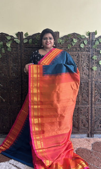 Gadwal Silk Saree Peacock Blue Colored Complemented With a Peach Zari Border - Sampradaya Designer Studio
