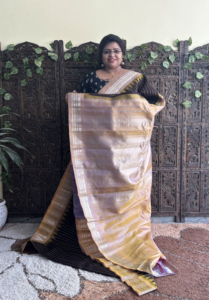 Gadwal Silk Saree Black Colored Complemented With a Light Yellow Zari Border - Sampradaya Designer Studio