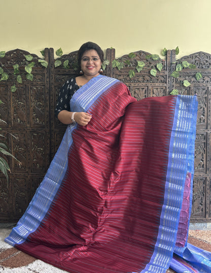 Gadwal Silk Saree Maroon Colored Complemented With a Gray Zari Border - Sampradaya Designer Studio
