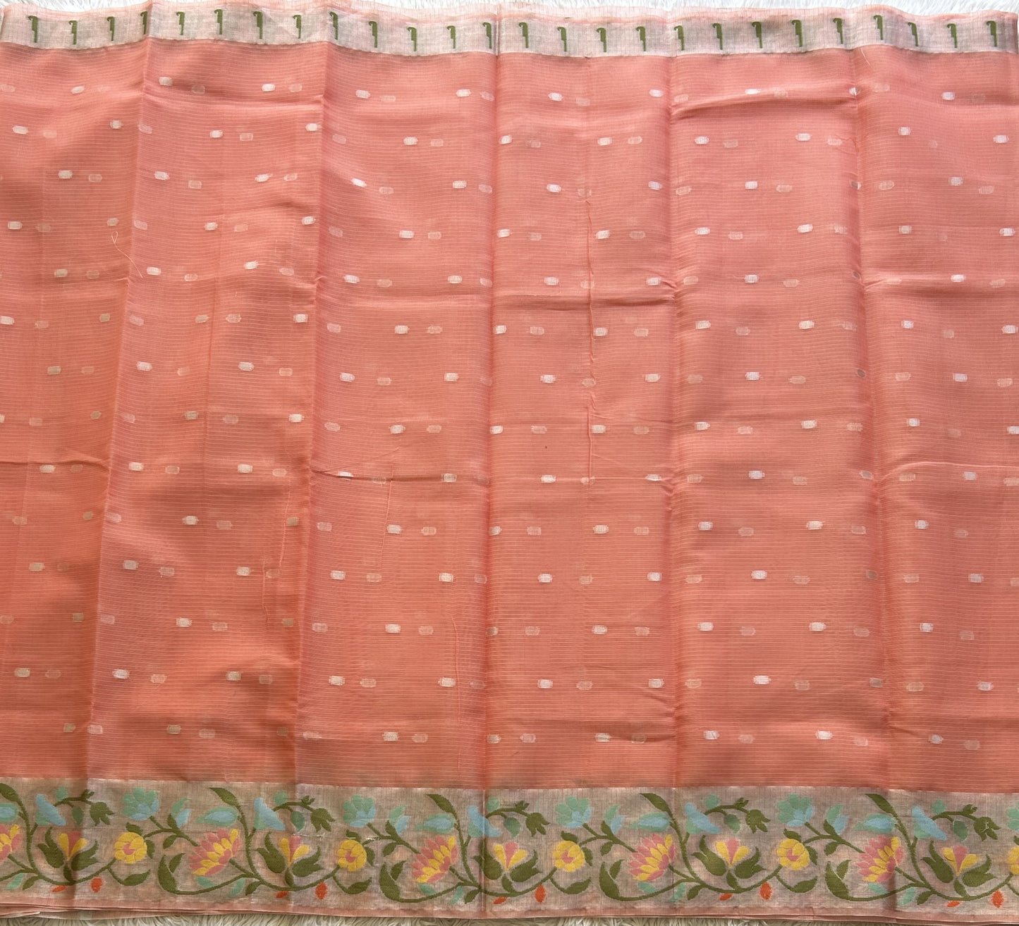 Silk Kota Saree Light Peach Colored Elegantly Paired with a Tissue Border