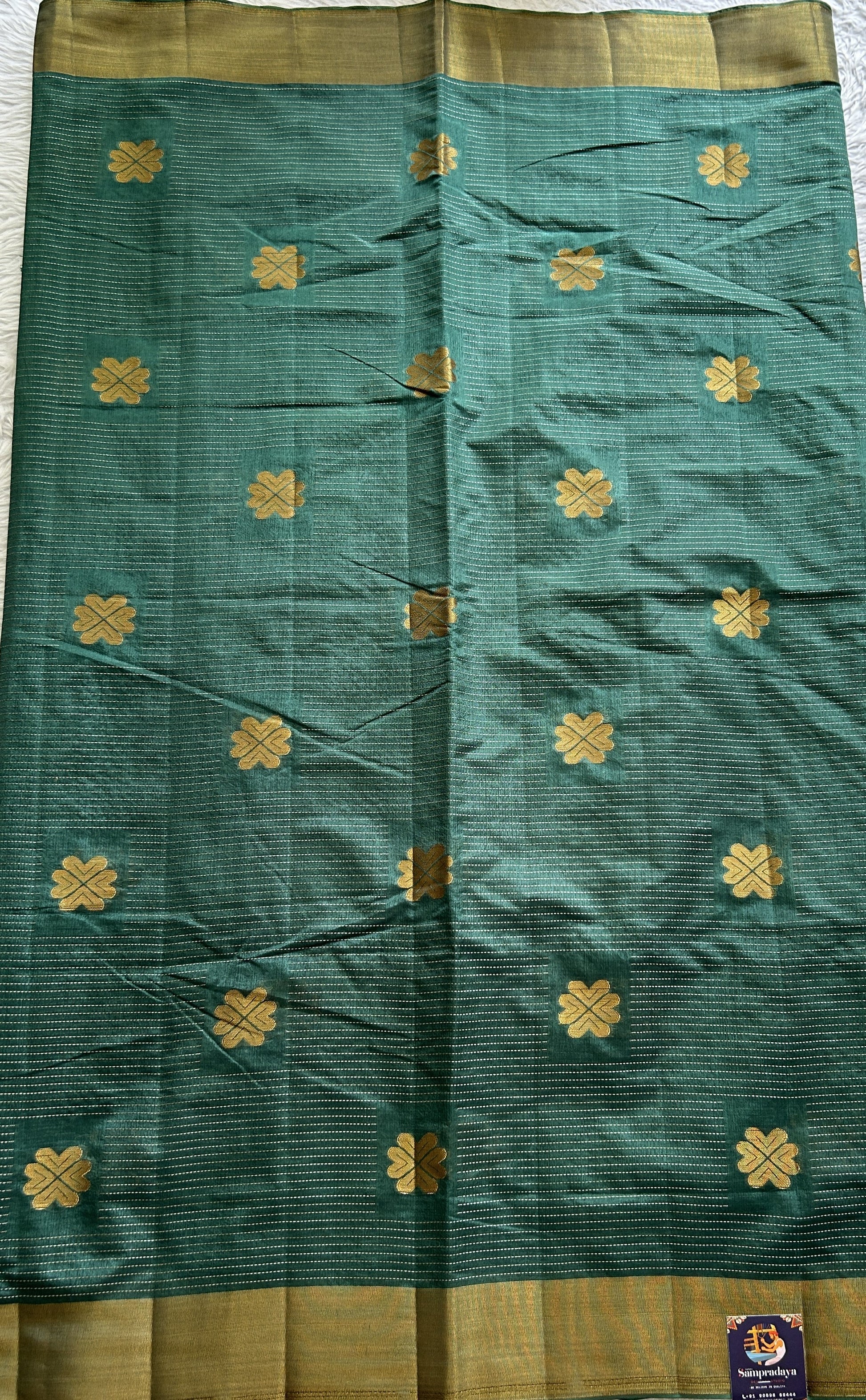 Semi Tussar Saree Bottle Green Colored Complemented with a Zari Border. - Sampradaya Designer Studio