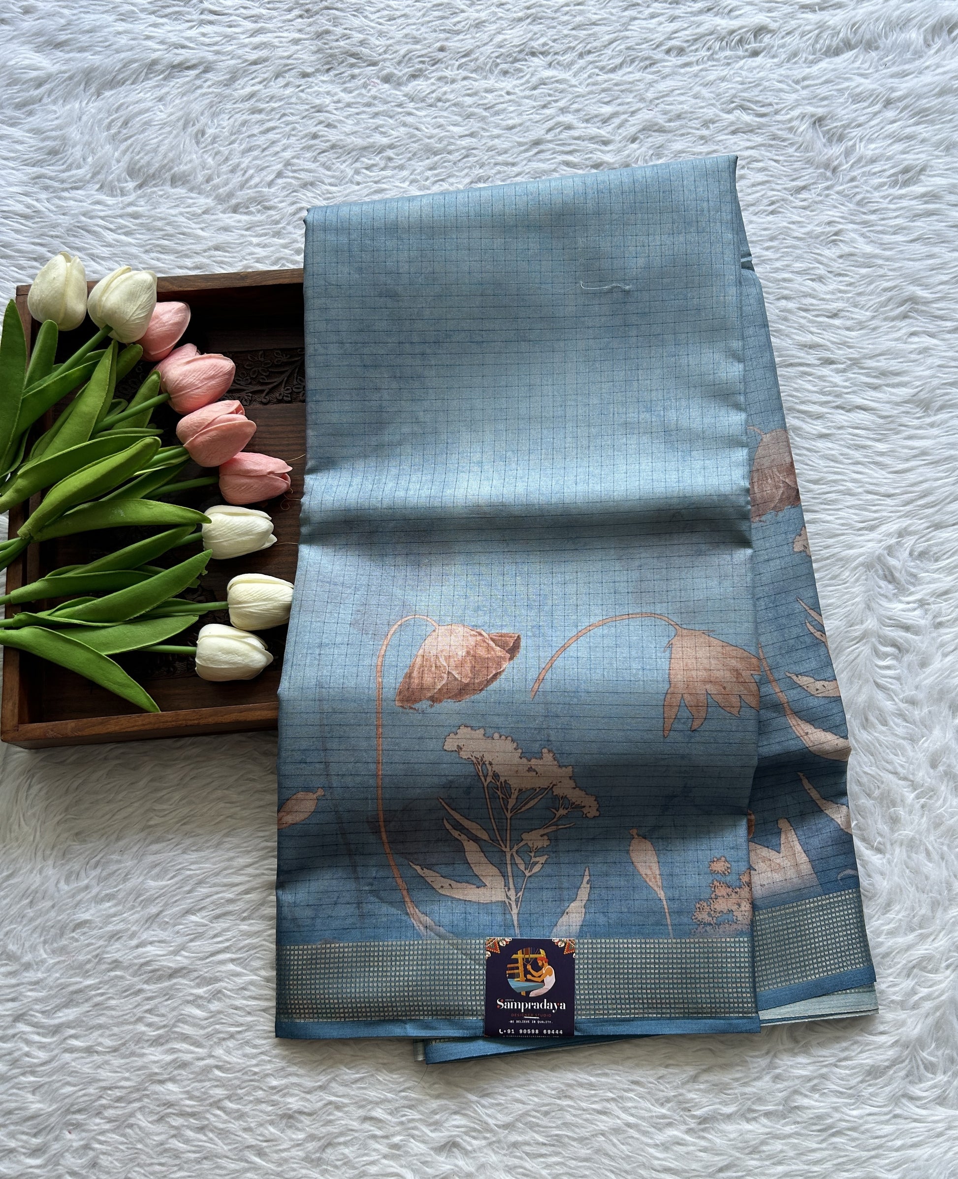 Semi Tussar Saree Light Blue Colored complemented with a Zari Border. - Sampradaya Designer Studio