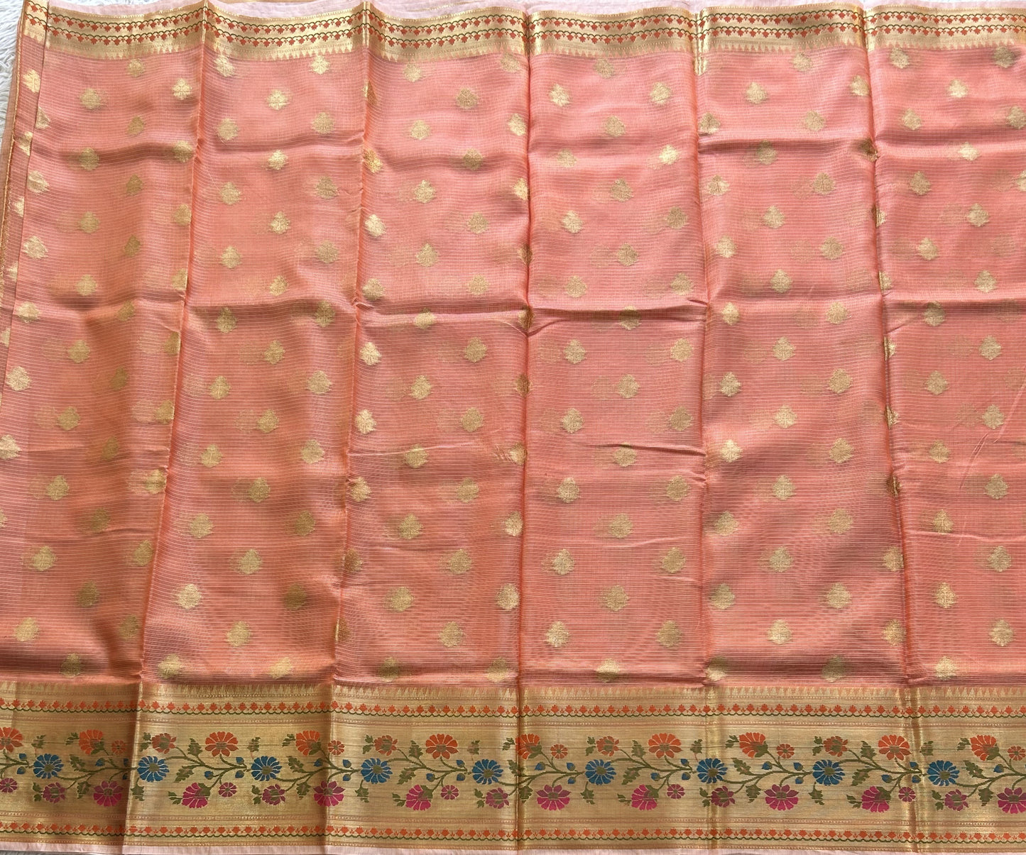 Tissue Kota Saree Dark Peach Colored Elegantly Paired with a Tissue Border