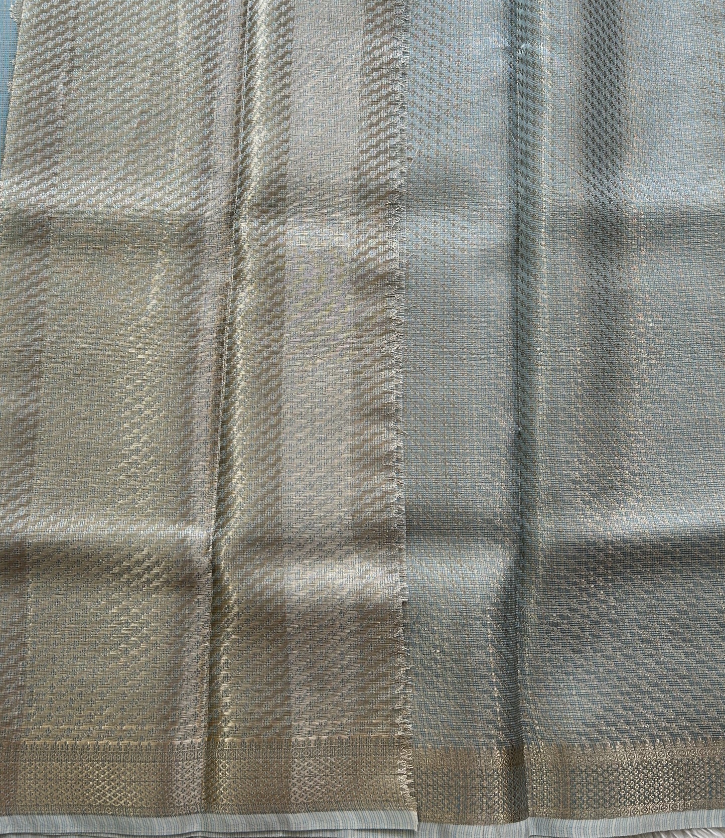 Tissue Kota Saree Ice Blue Colored Elegantly Paired with a Tissue Border