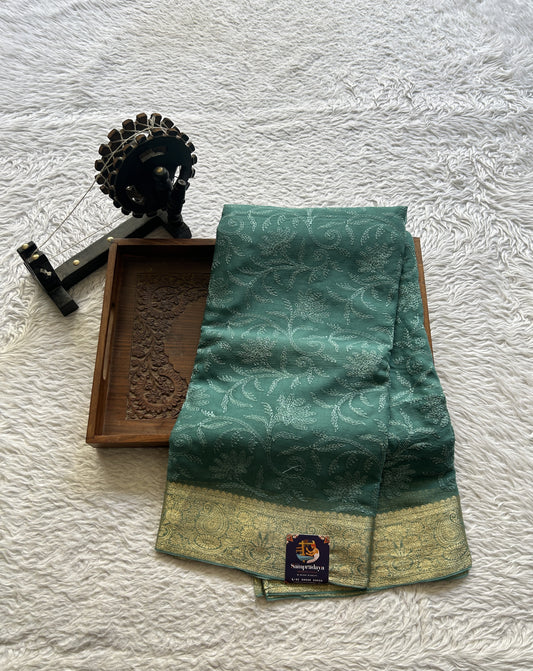 Semi Georgette Saree Light Peacock Green Colored Elegantly Paired with a Zari Border. - Sampradaya Designer Studio