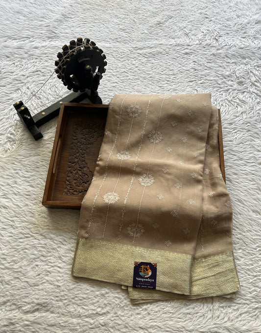 Semi Georgette Saree Buff Colored Elegantly Paired with a Zari Border. - Sampradaya Designer Studio