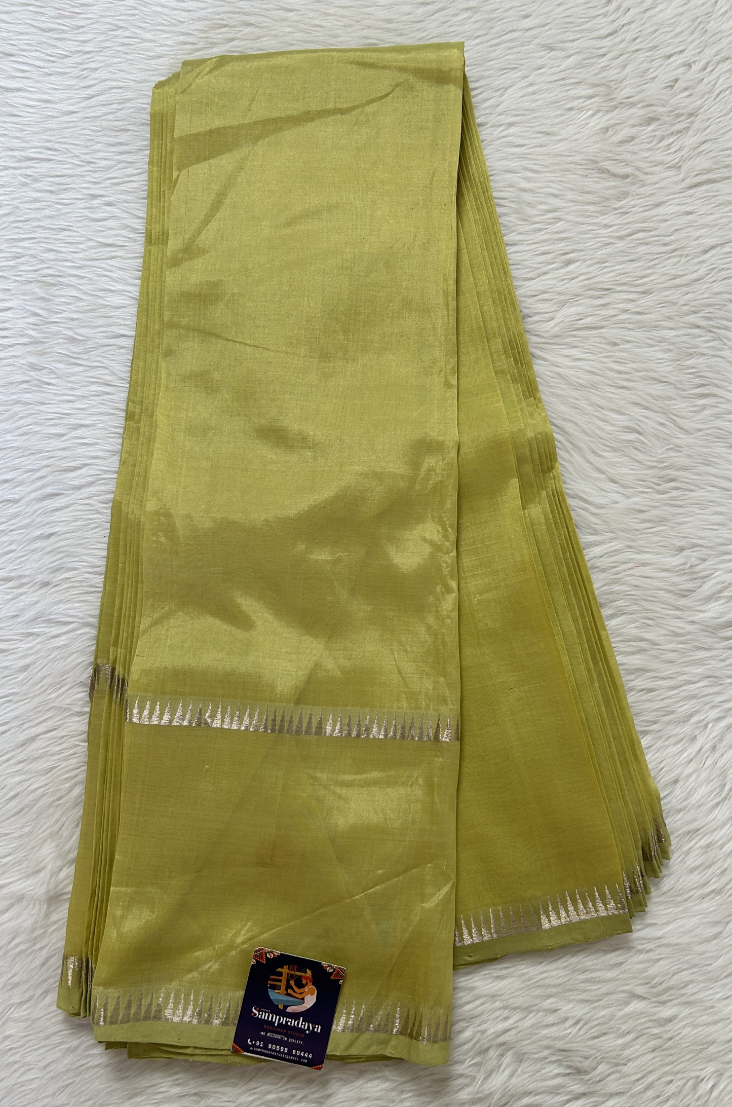 Mangalagiri Plain Pattu Saree Lemon Green colored Saree complemented with a Silver Mangalagiri Gap Border - Sampradaya Designer Studio