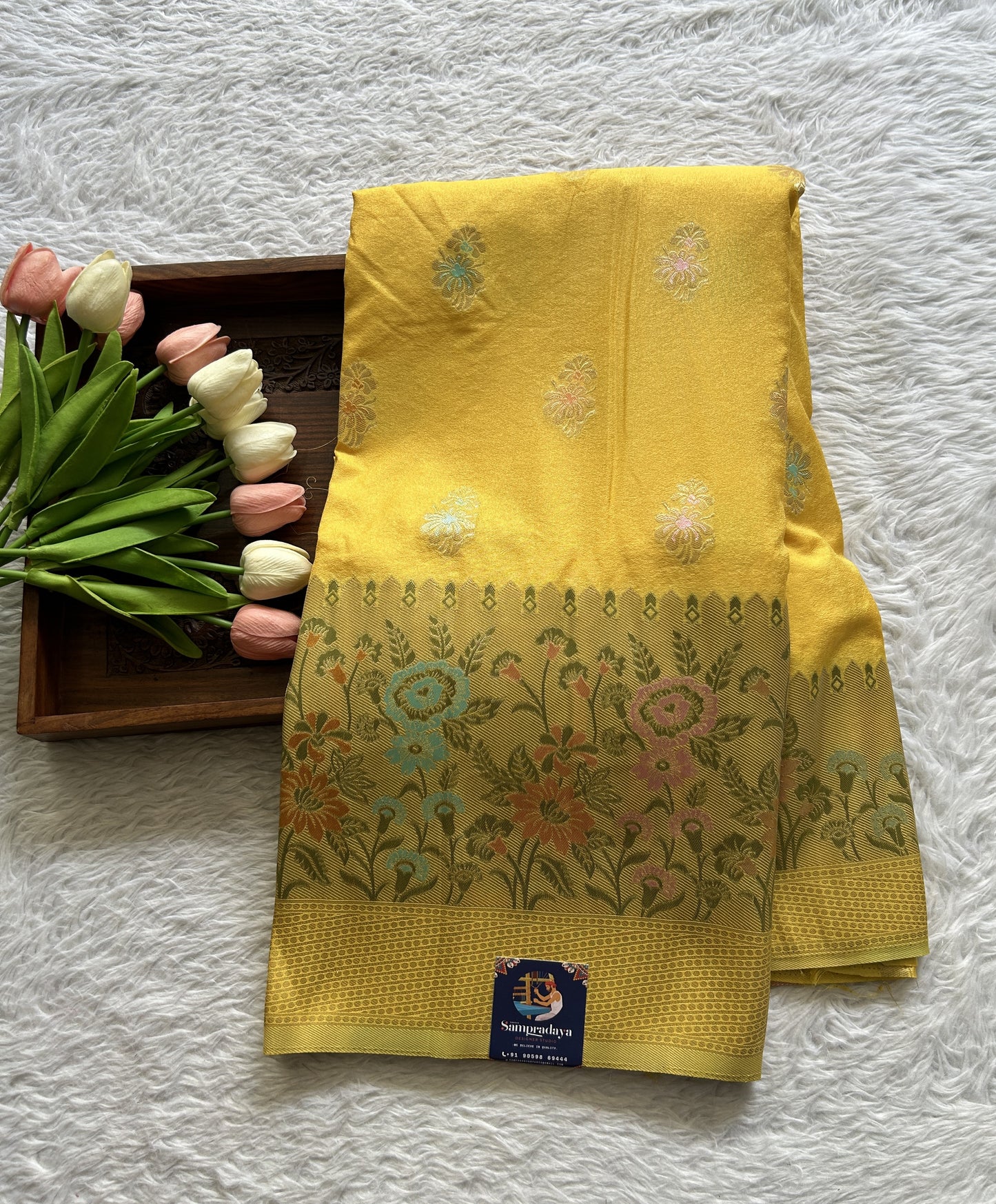 Semi Georgette Saree Yellow Colored Complemented with a Zari Border. - Sampradaya Designer Studio