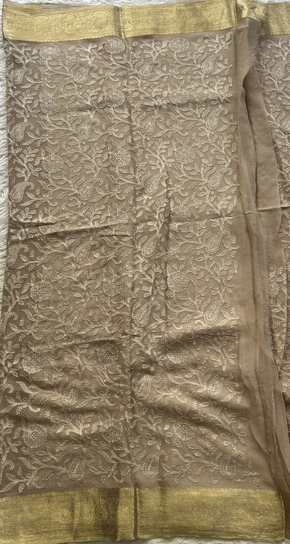 Semi Georgette Saree Very Light Brown Colored Elegantly Paired with a Zari Border. - Sampradaya Designer Studio