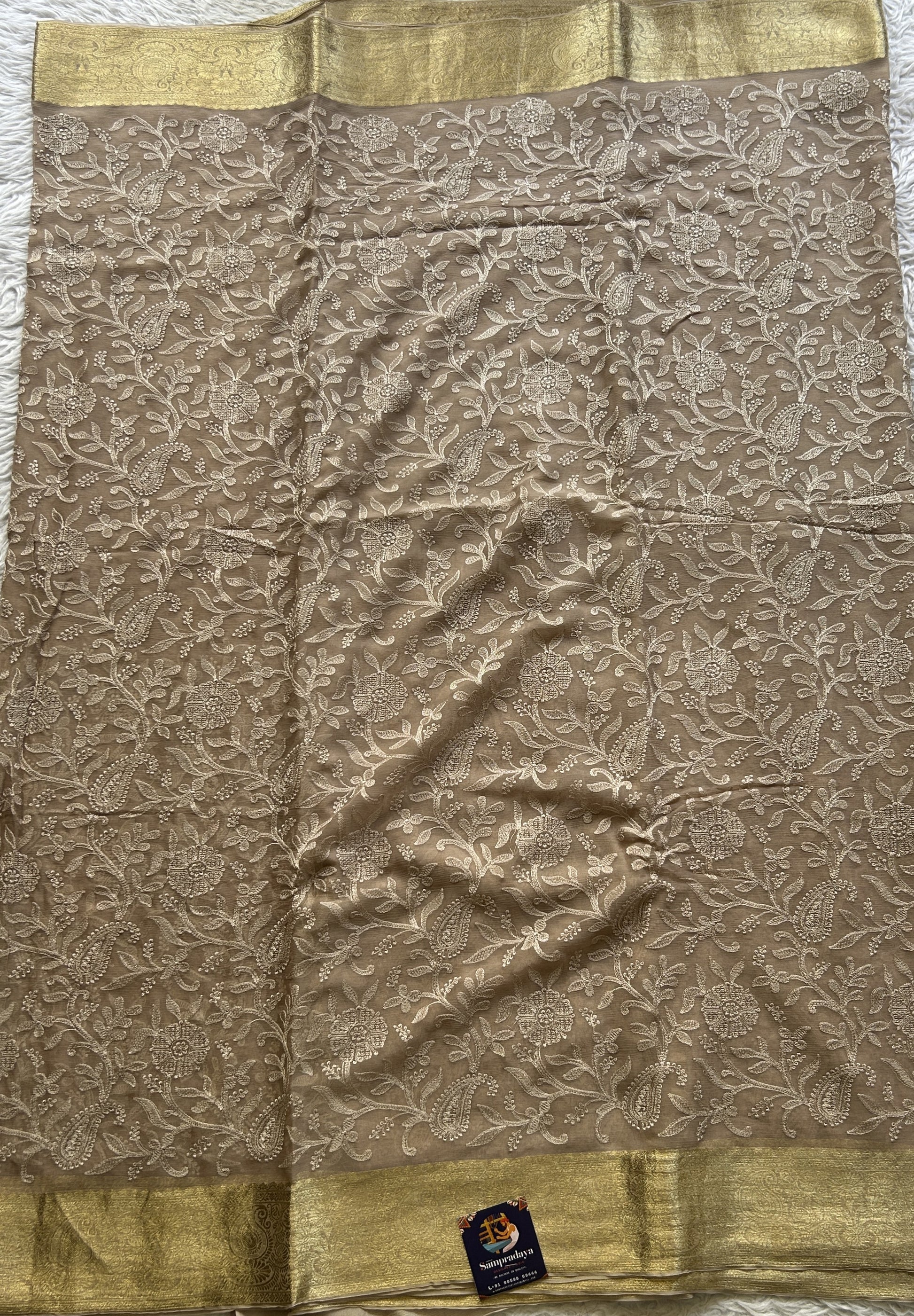 Semi Georgette Saree Very Light Brown Colored Elegantly Paired with a Zari Border. - Sampradaya Designer Studio