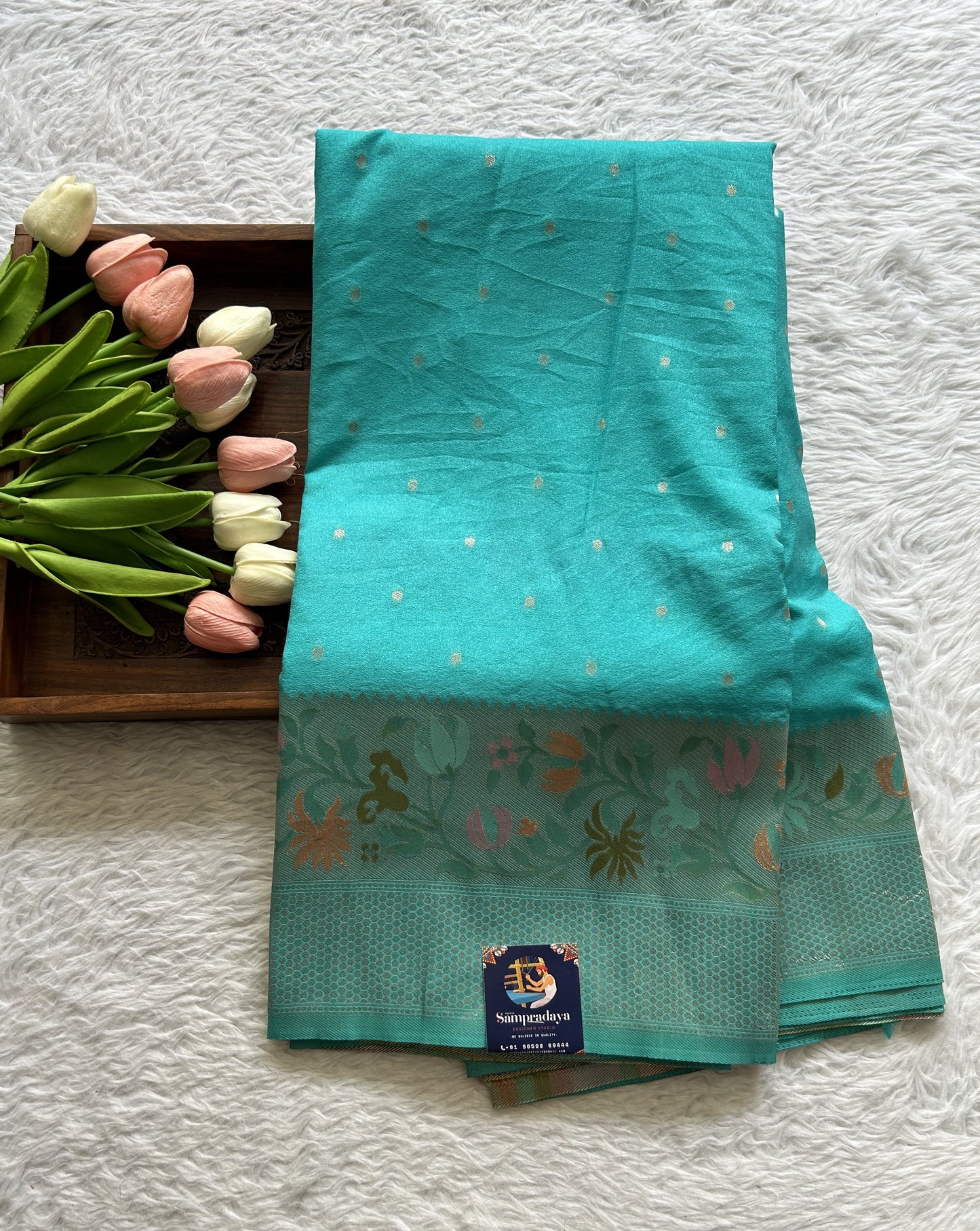Semi Georgette Saree Sea Blue Colored Complemented with a Zari Border. - Sampradaya Designer Studio