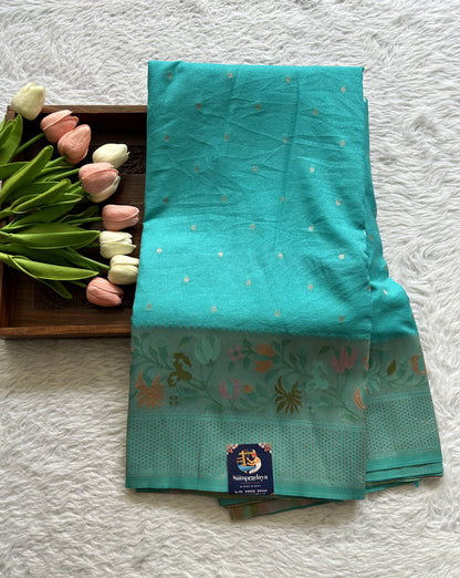 Semi Georgette Saree Sea Blue Colored Complemented with a Zari Border. - Sampradaya Designer Studio