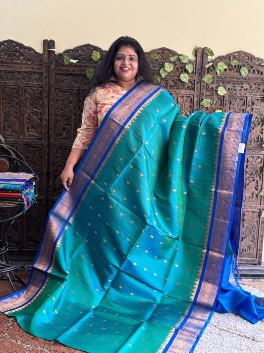 Gadwal Silk Saree Dark Aqua Colored Complemented With Gold Zari Border