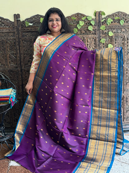 Gadwal Silk Saree Violet Colored Complemented With Gold Zari Border