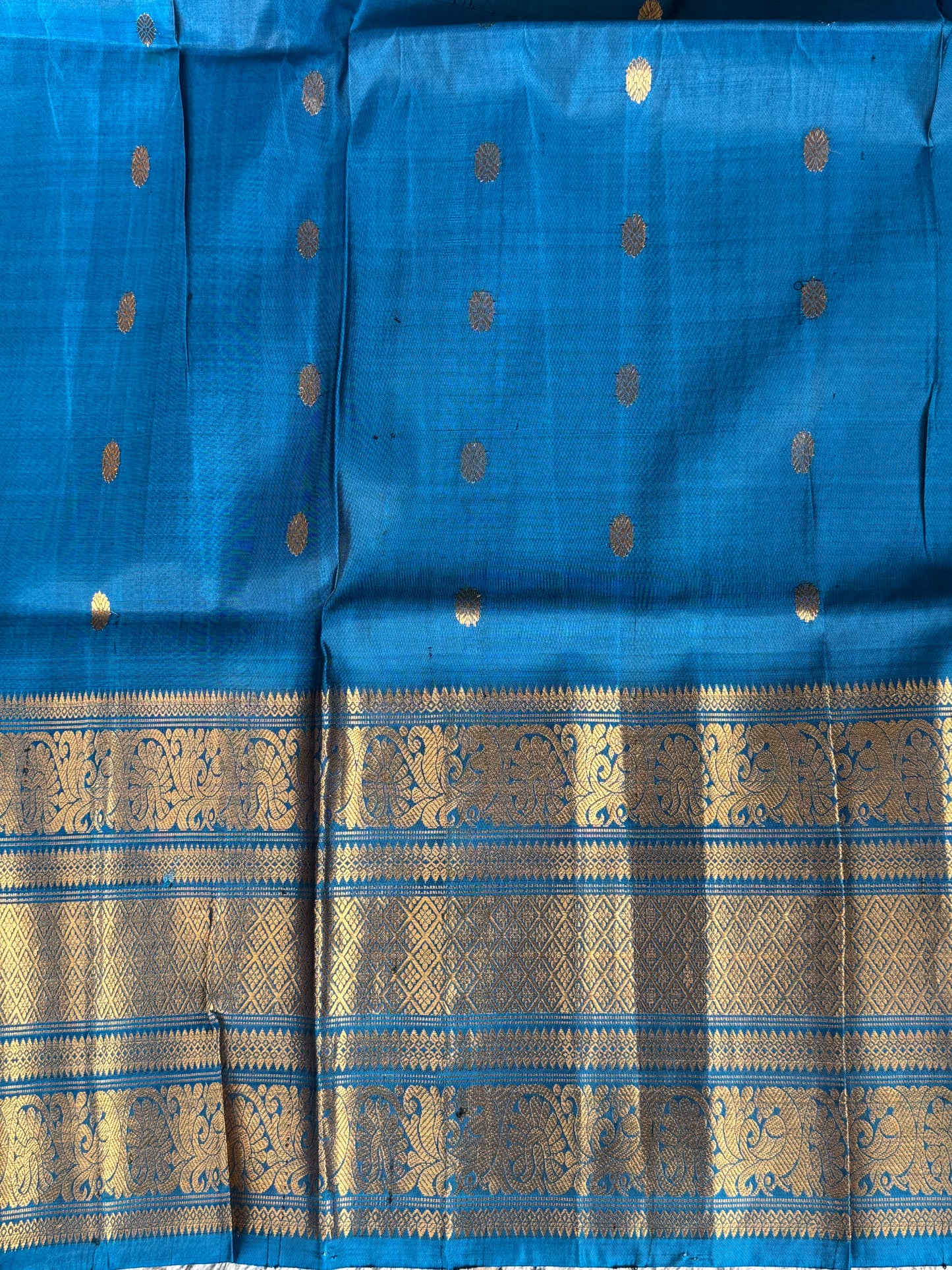 Gadwal Silk Saree Violet Colored Complemented With Gold Zari Border