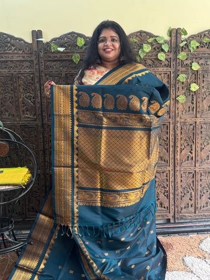 Gadwal Silk Saree teal Blue Colored Complemented With Gold Zari Border