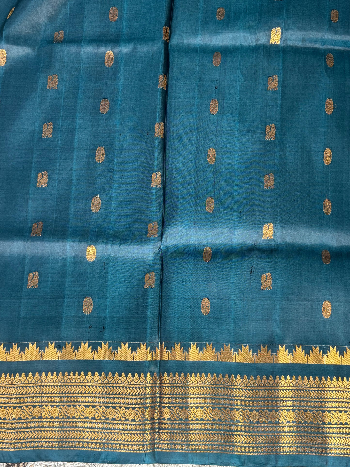 Gadwal Silk Saree teal Blue Colored Complemented With Gold Zari Border