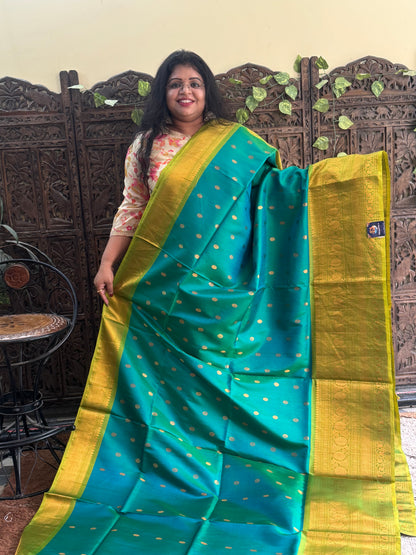 Gadwal Silk Saree Pine Green Colored Complemented With Gold Zari Border - Sampradaya Designer Studio