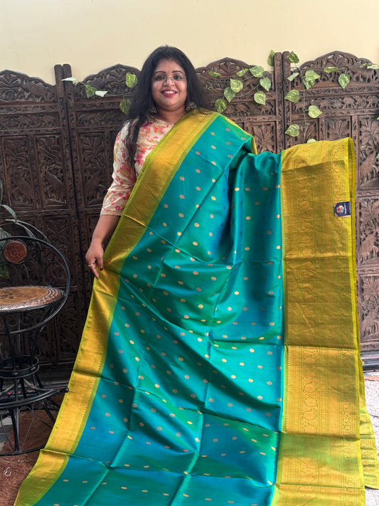 Gadwal Silk Saree Pine Green Colored Complemented With Gold Zari Border