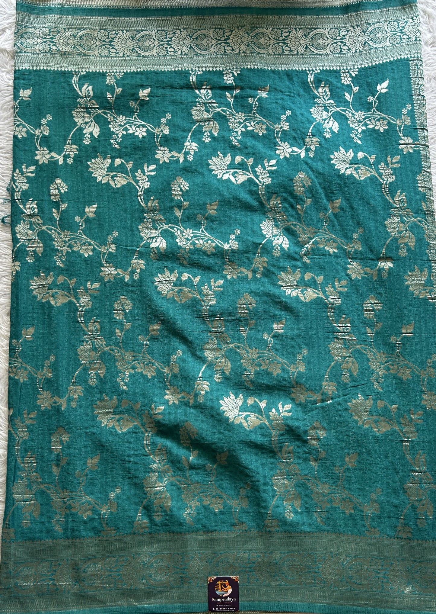 Semi Georgette Saree Turquoise Blue Colored Complemented with a Zari Border. - Sampradaya Designer Studio