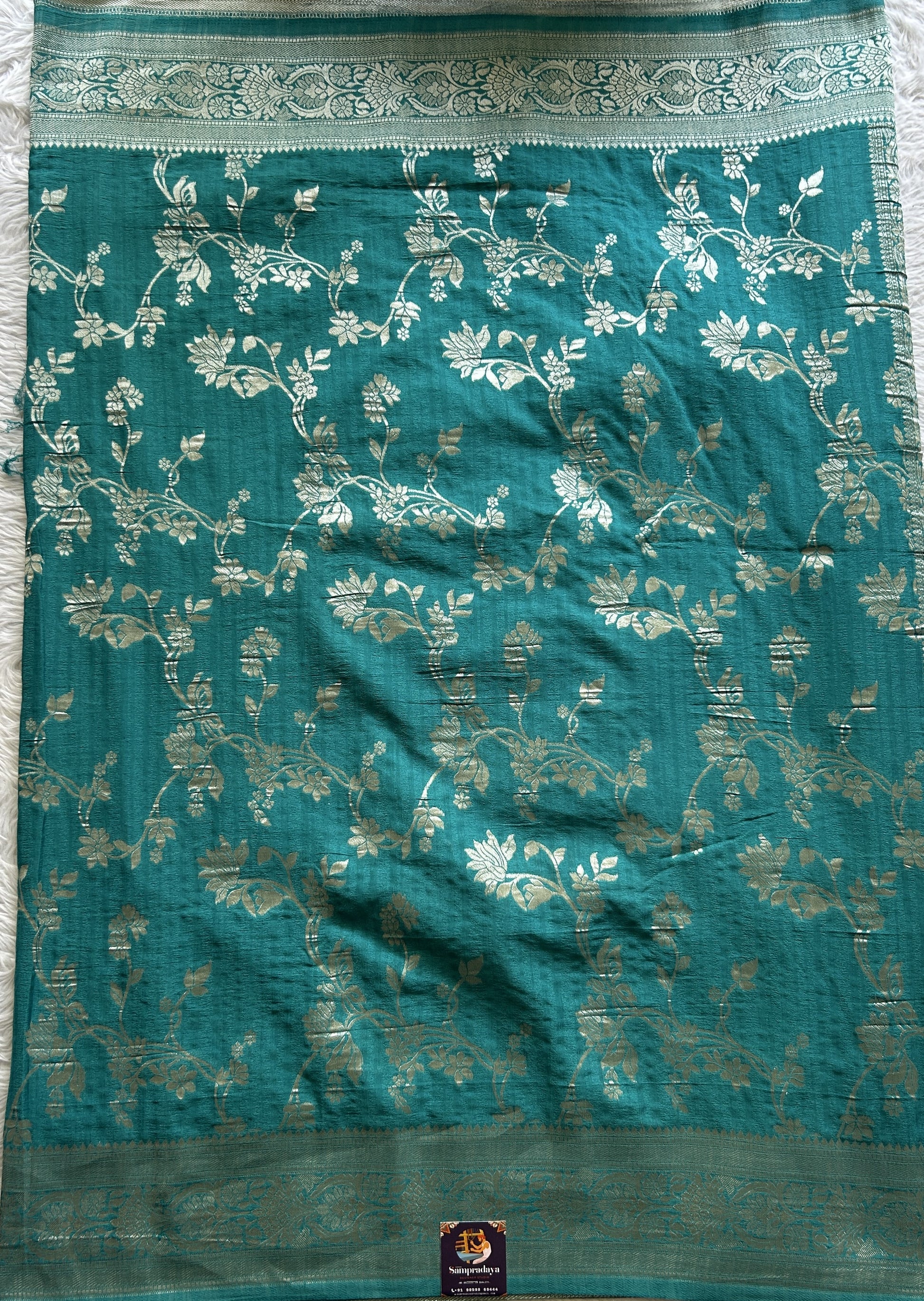 Semi Georgette Saree Turquoise Blue Colored Complemented with a Zari Border. - Sampradaya Designer Studio