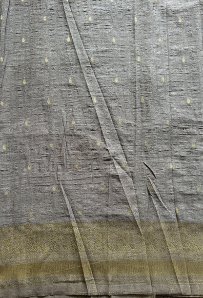 Semi Georgette Saree Ash Colored Complemented with a Zari Border. - Sampradaya Designer Studio
