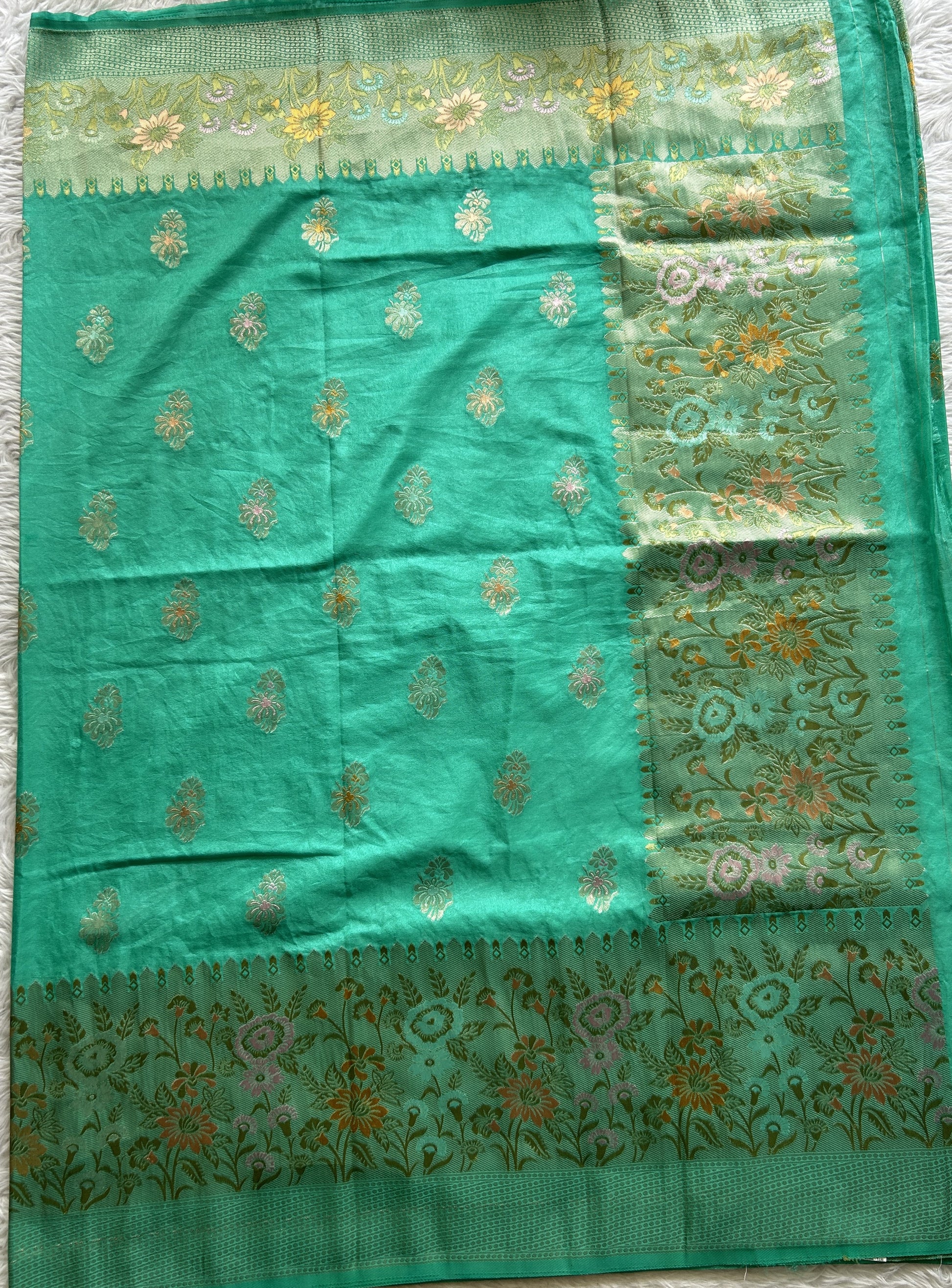 Semi Georgette Saree Sea Green Colored Complemented with a Zari Border. - Sampradaya Designer Studio