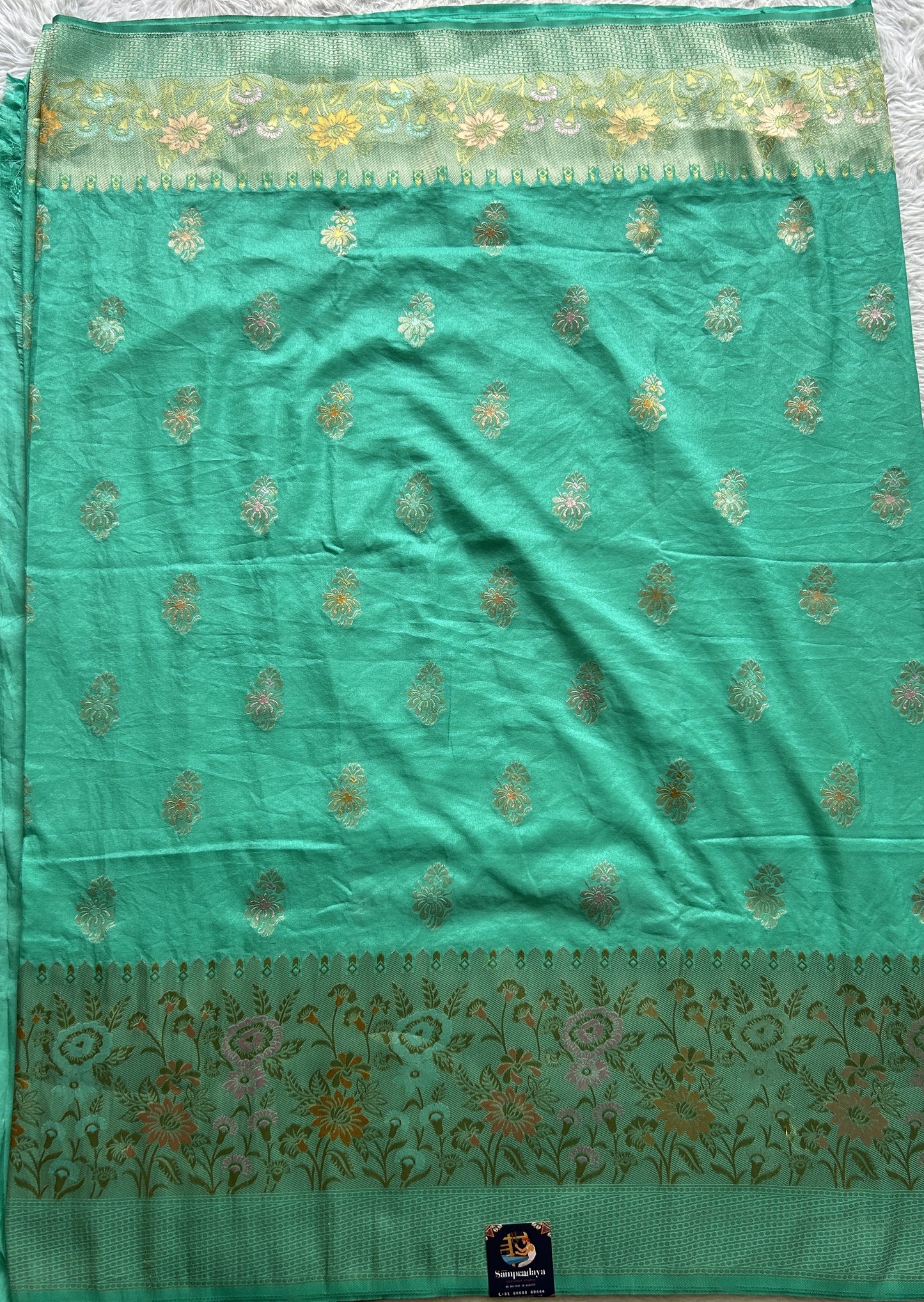 Semi Georgette Saree Sea Green Colored Complemented with a Zari Border. - Sampradaya Designer Studio