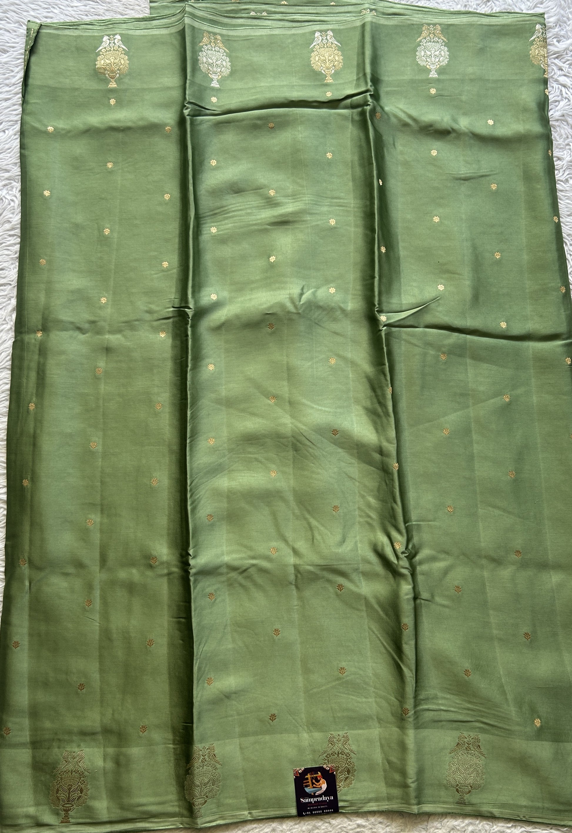 Mona Silk Saree Green Colored Complemented with a Buti Border. - Sampradaya Designer Studio