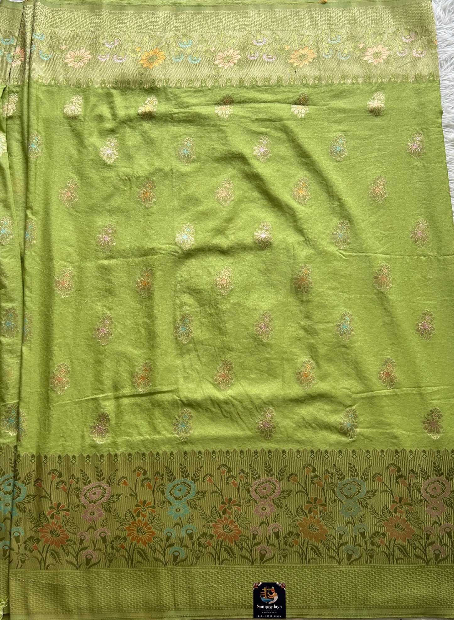 Semi Georgette Saree Lime Green Colored Complemented with a Zari Border. - Sampradaya Designer Studio