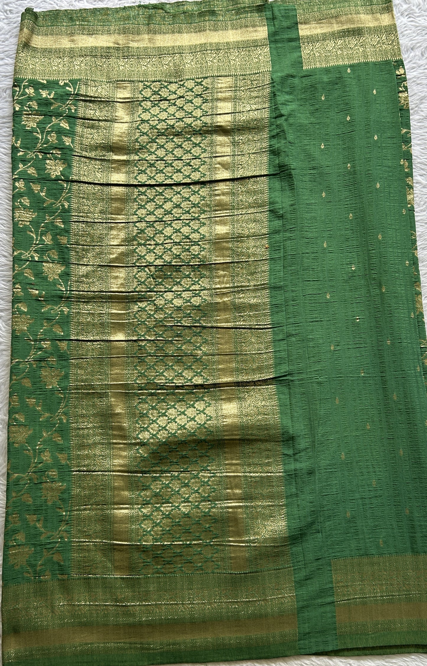 Semi Georgette Saree Green Colored Complemented with a Zari Border. - Sampradaya Designer Studio