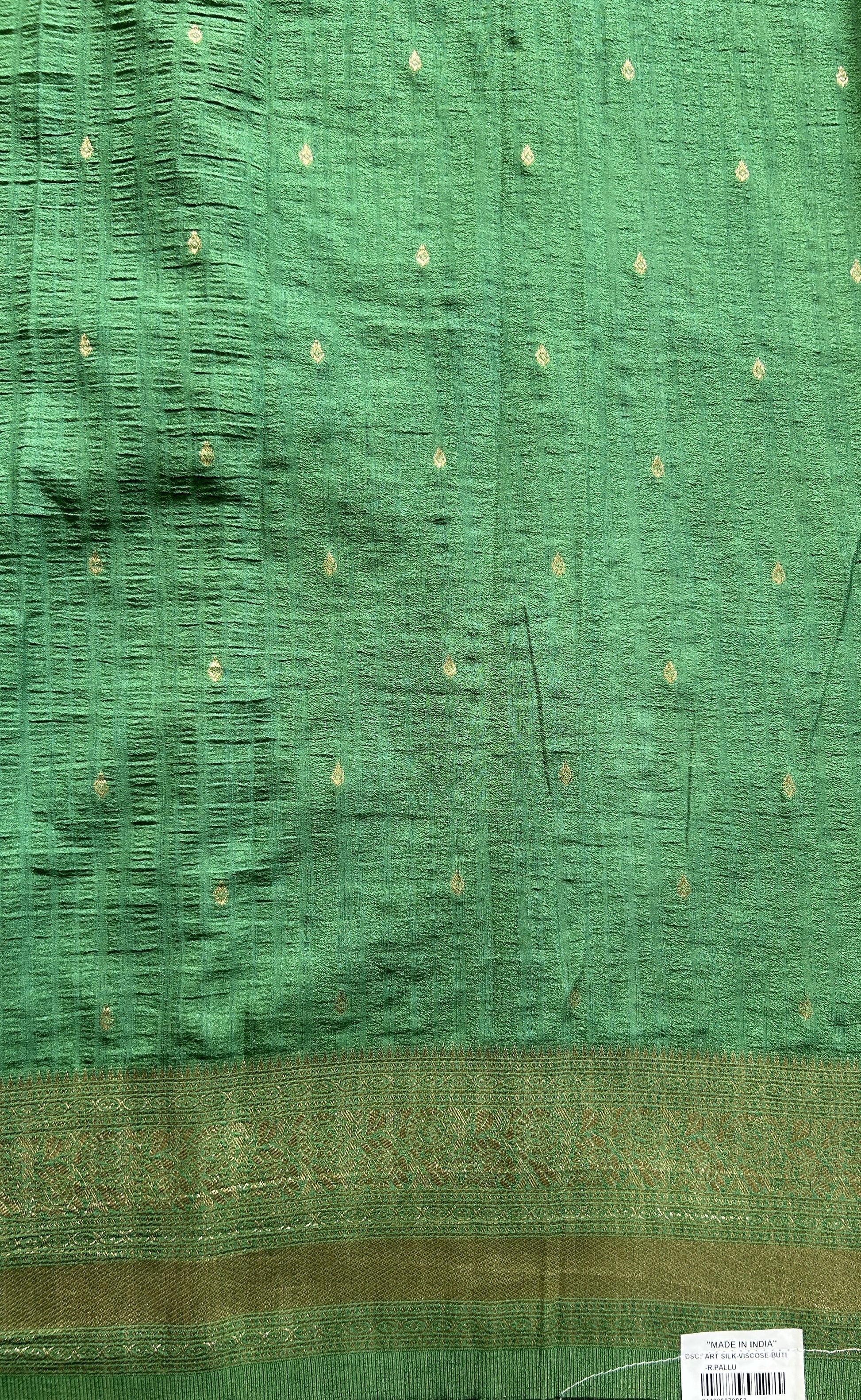 Semi Georgette Saree Green Colored Complemented with a Zari Border. - Sampradaya Designer Studio