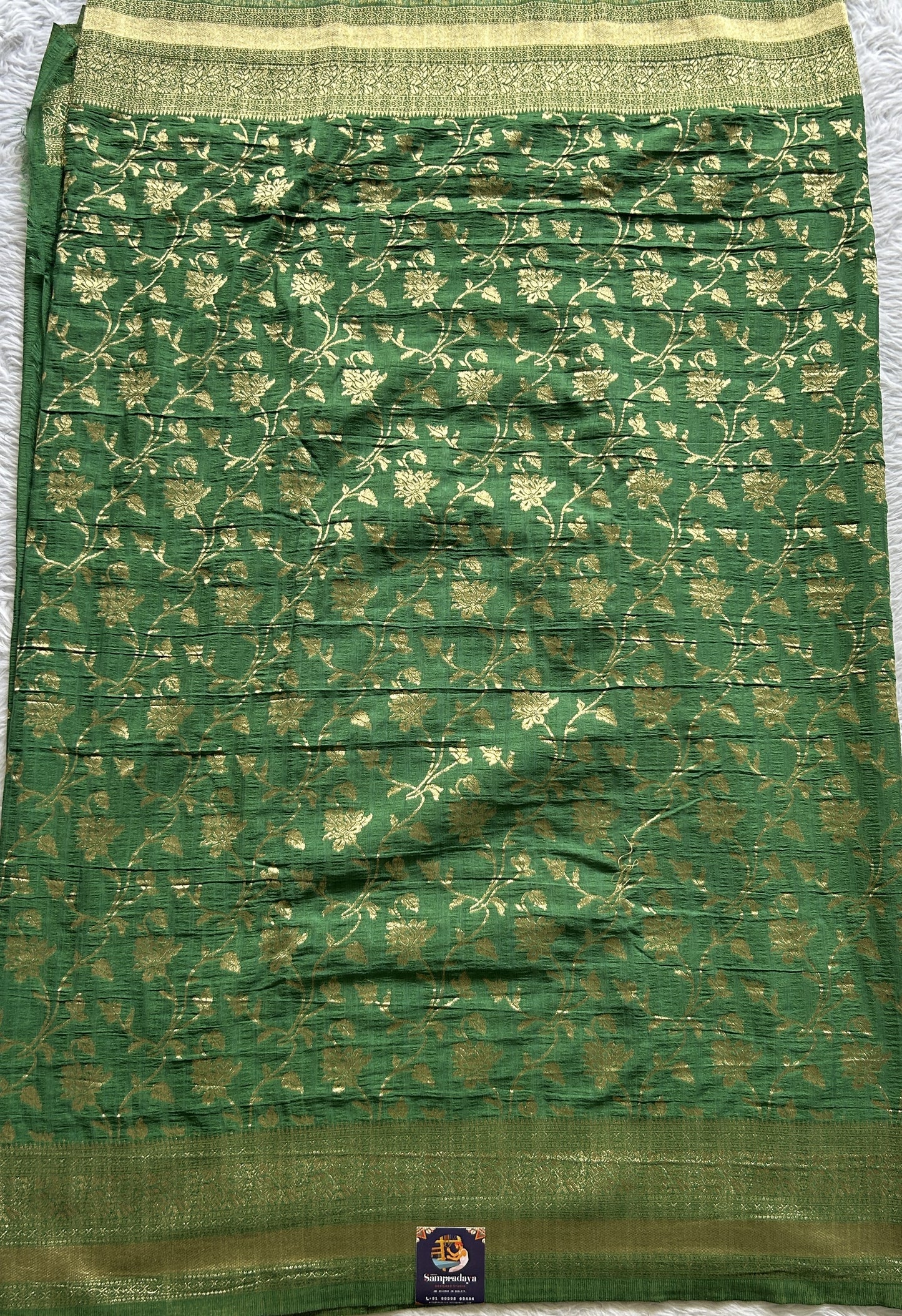 Semi Georgette Saree Green Colored Complemented with a Zari Border. - Sampradaya Designer Studio