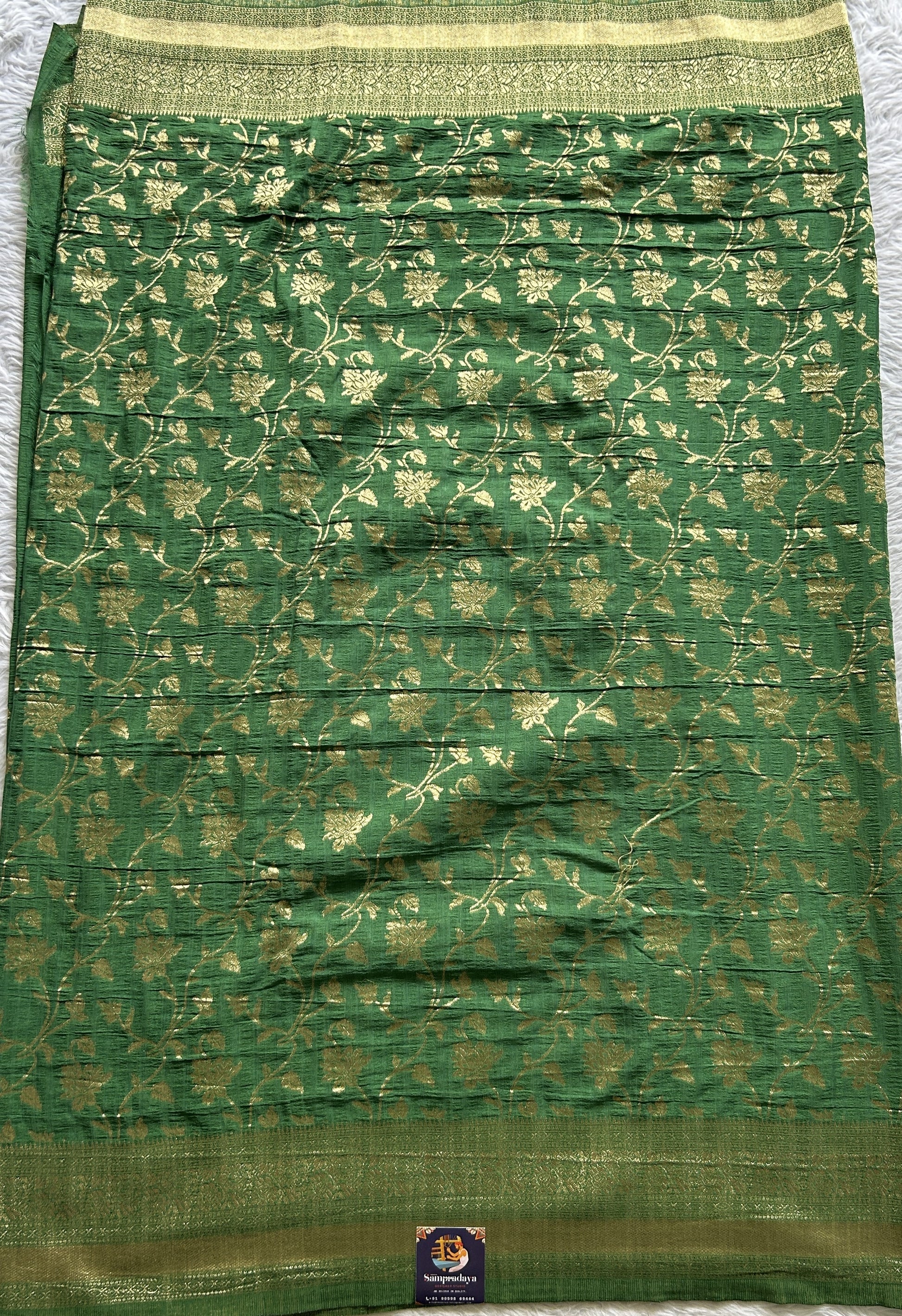 Semi Georgette Saree Green Colored Complemented with a Zari Border. - Sampradaya Designer Studio