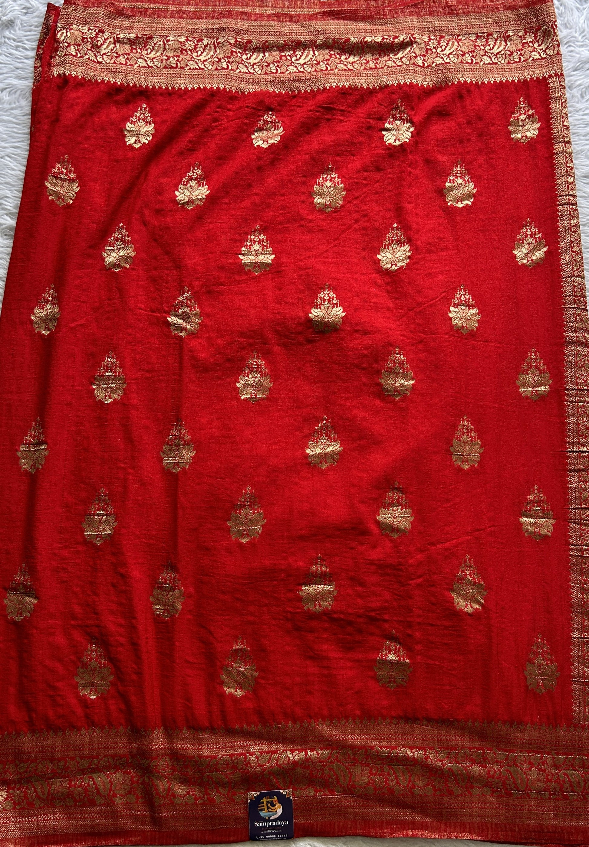 Semi Georgette Saree Red Colored Complemented with a Zari Border. - Sampradaya Designer Studio