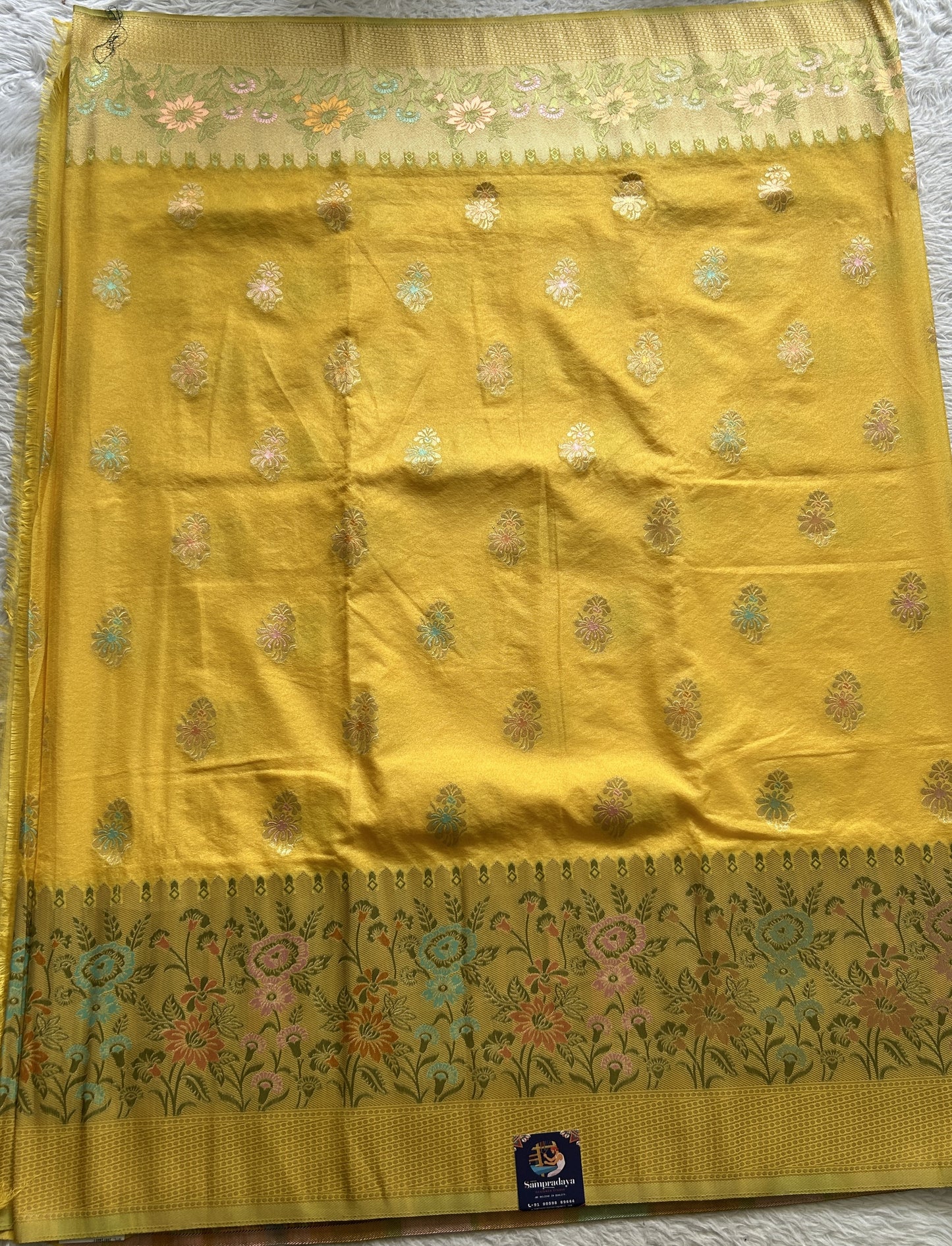 Semi Georgette Saree Yellow Colored Complemented with a Zari Border. - Sampradaya Designer Studio
