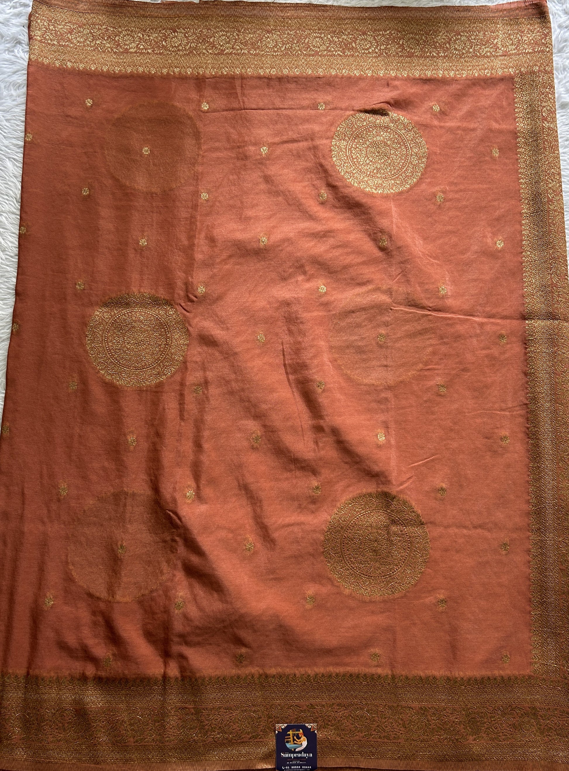 Semi Georgette Saree Dark Peach Colored Complemented with a Zari Border. - Sampradaya Designer Studio