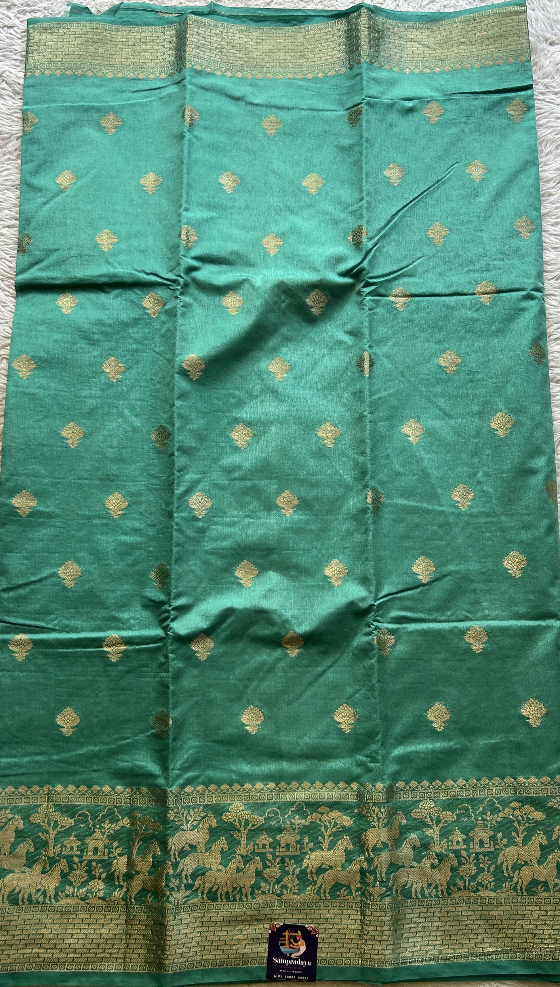 Semi Raw Silk Saree Aqua Blue Colored Complemented with a Zari Border. - Sampradaya Designer Studio