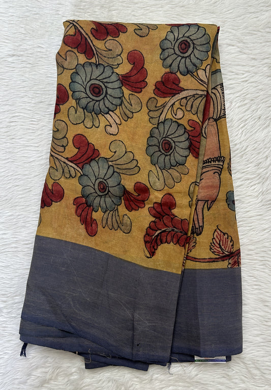 Pen Kalamkari Saree Turmeric Yellow colored allover saree complemented with a Dusty Blue Colored Plain border - Sampradaya Designer Studio