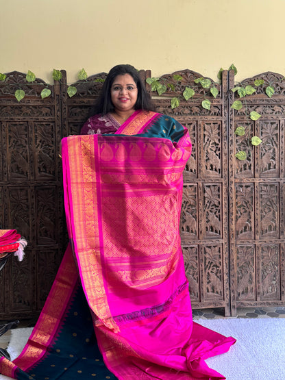 Gadwal Silk Saree Dark Teal Blue Colored Complemented With Gold Zari Border