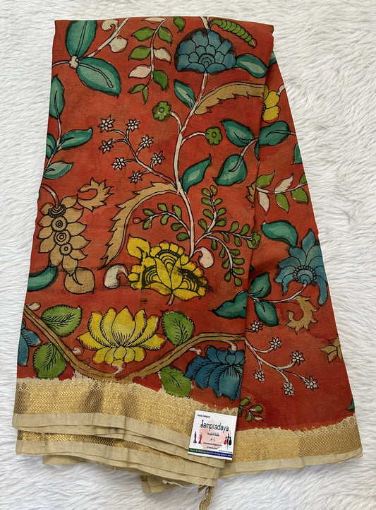 Pen Kalamkari Saree Orange colored allover saree complemented with a Cream Colored Gold Zari border - Sampradaya Designer Studio
