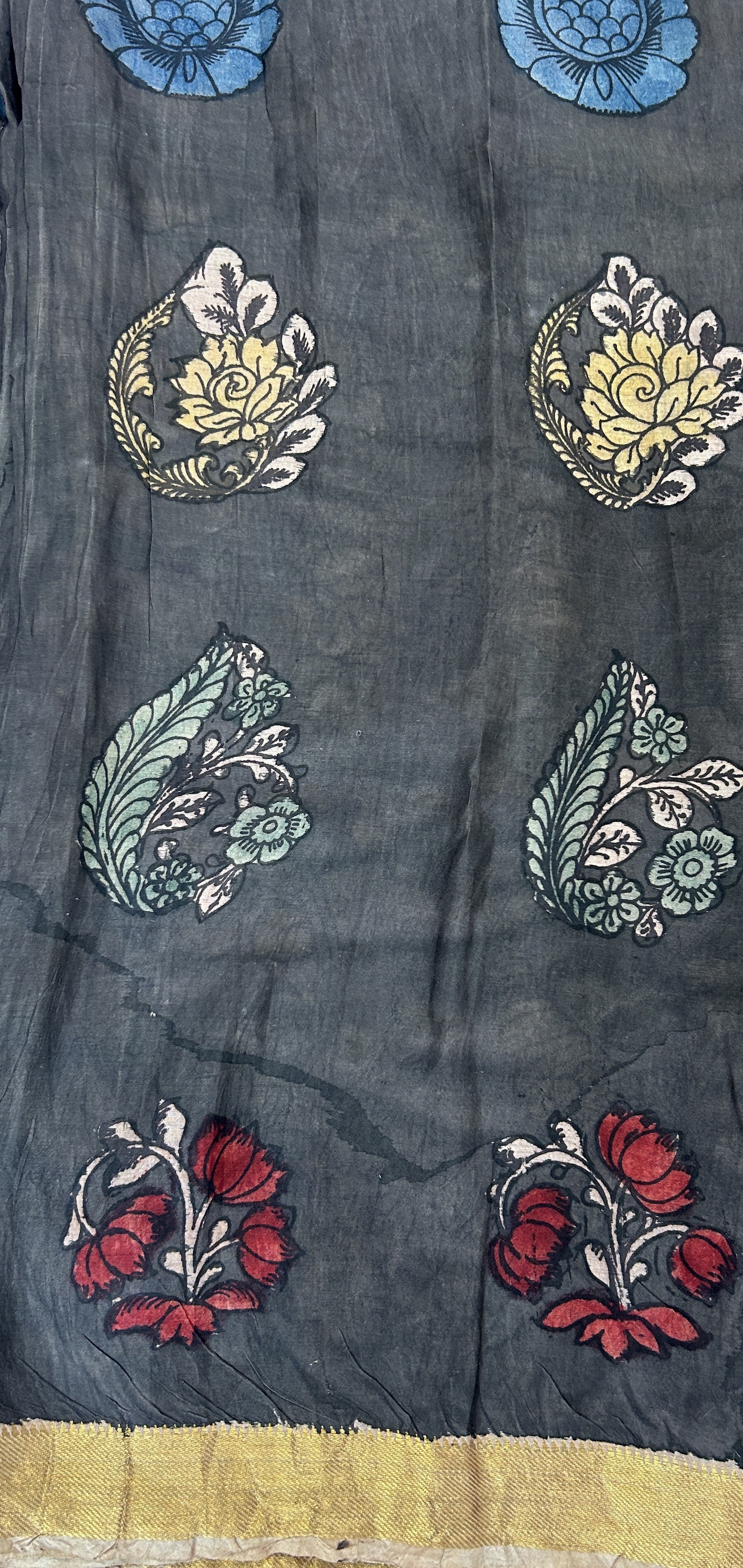 Pen Kalamkari Saree Red colored allover saree complemented with a Gold Zari border - Sampradaya Designer Studio