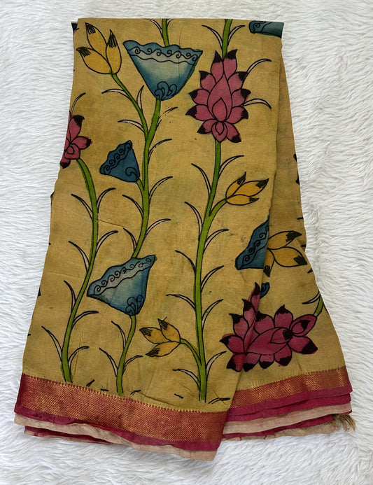 Pen Kalamkari Saree Mustard yellow colored allover saree complemented with a Pastel Red Colored Gold Zari border - Sampradaya Designer Studio