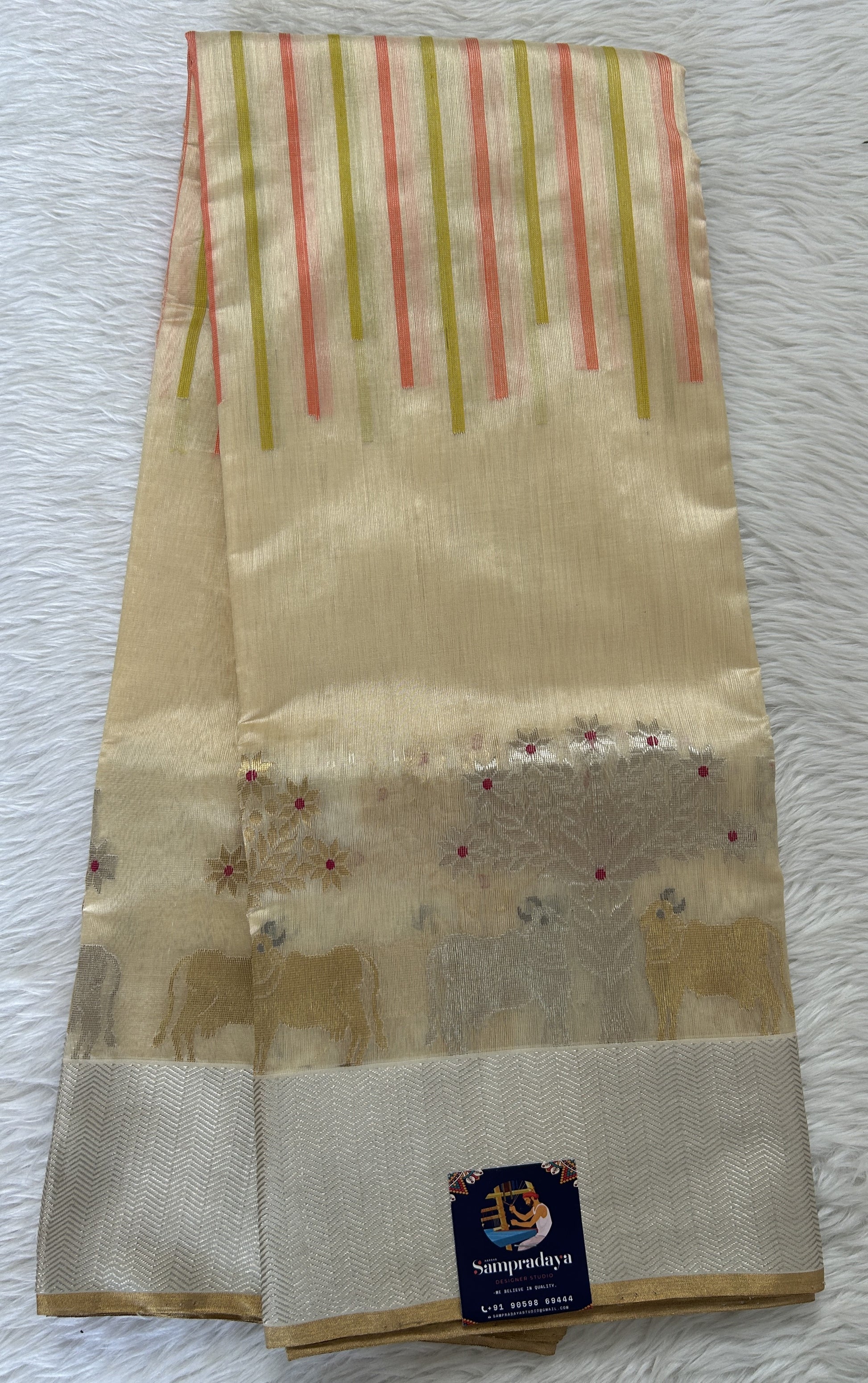 Chanderi Pattu Saree Cream colored saree complemented with a Silver Zari border - Sampradaya Designer Studio
