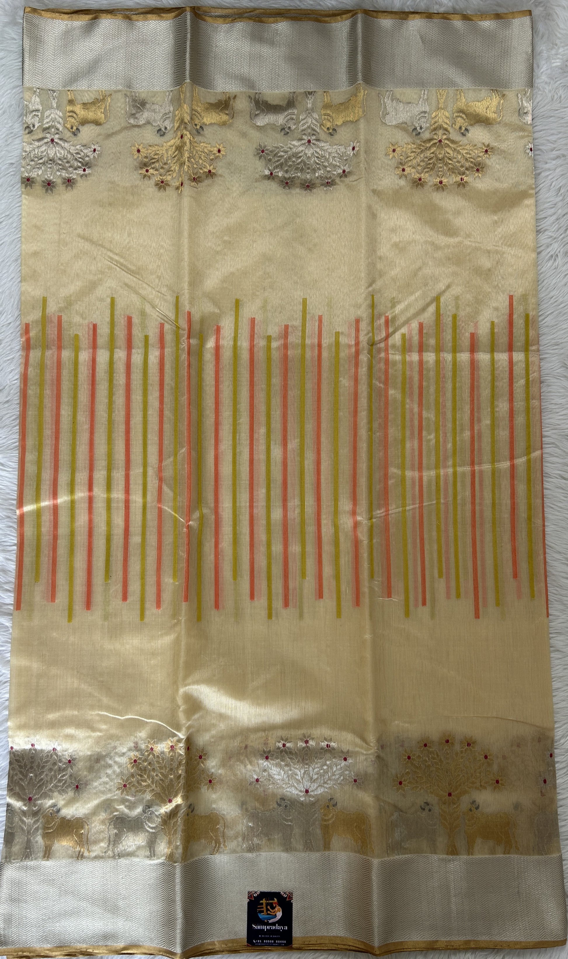 Chanderi Pattu Saree Cream colored saree complemented with a Silver Zari border - Sampradaya Designer Studio