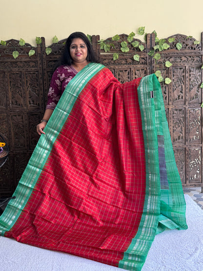 Gadwal Silk Saree Crimson Red Colored Complemented With Silver Zari Border