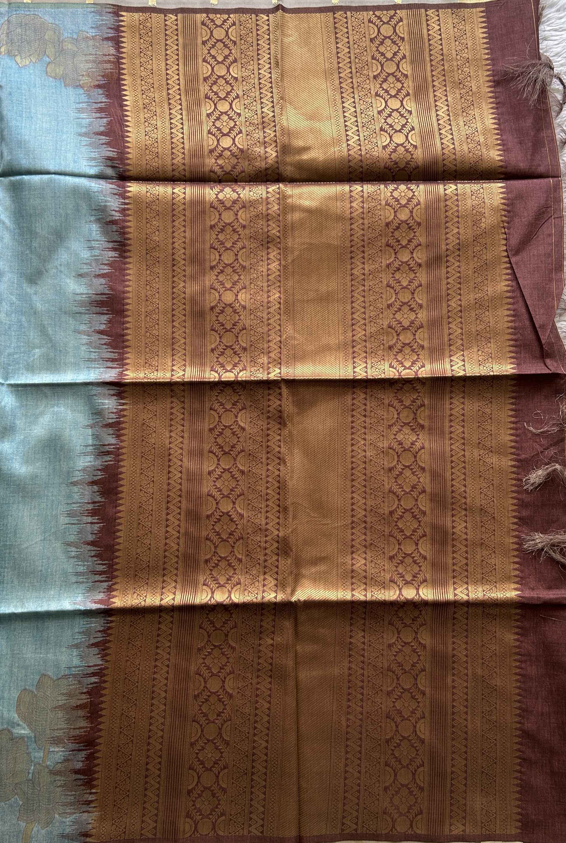 Semi Tussar Saree Sky Blue Colored complemented with a Embosed Border. - Sampradaya Designer Studio