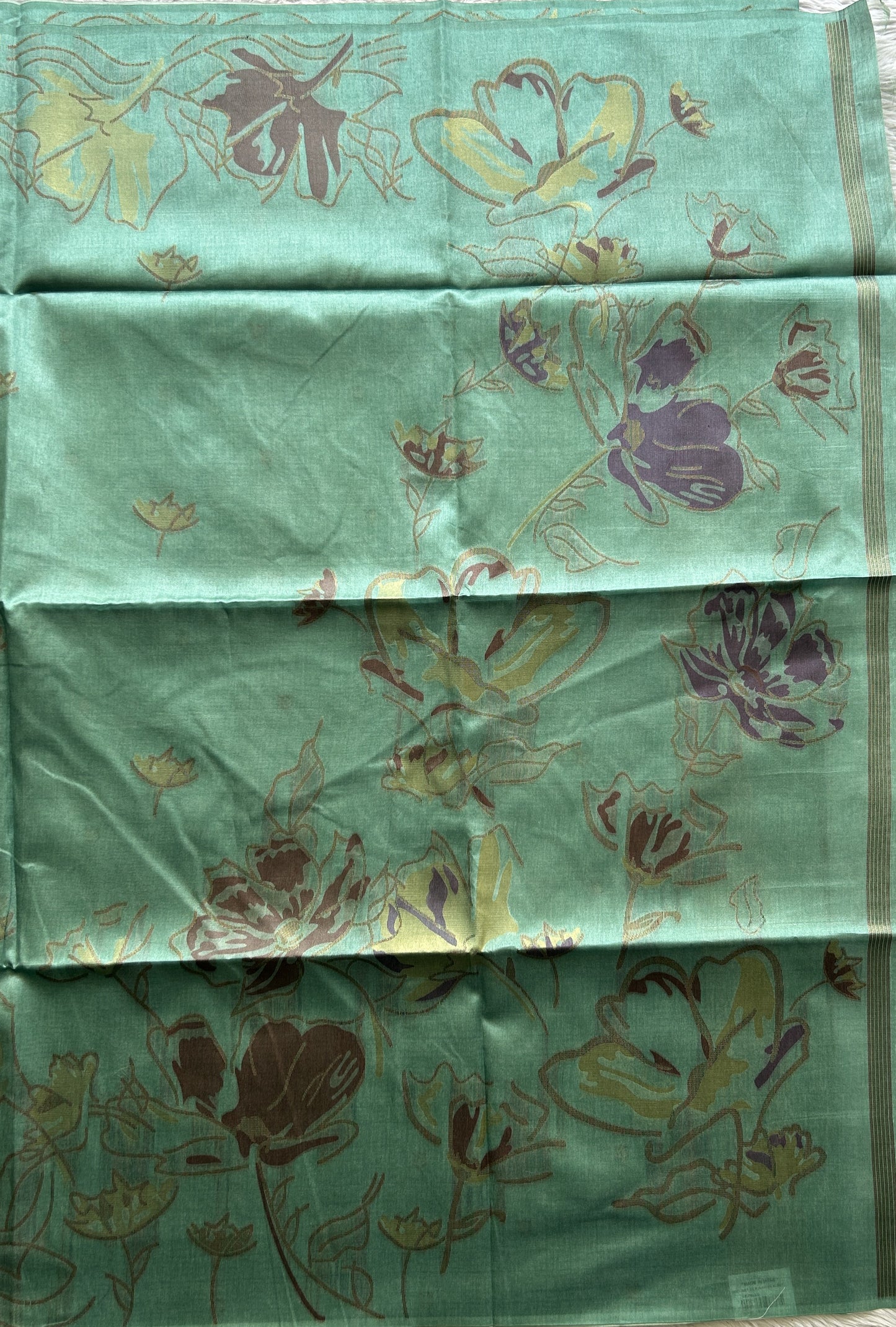 Semi Tussar Saree Ocean Green Colored complemented with a Embosed Border. - Sampradaya Designer Studio