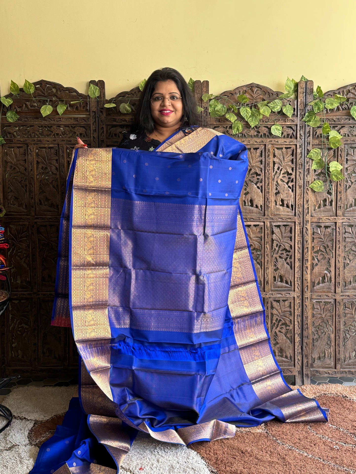 Pure Kanjivaram Silk Saree Dark Blue Colored Elegantly Paid with a Gold Zari Border.